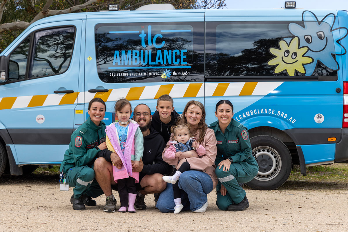 Variety Community Grant showing TLC kids ambulance with staff and family